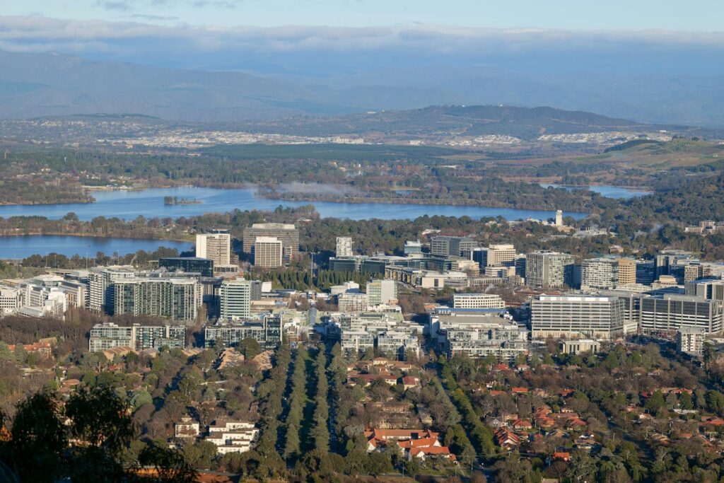 Aerial view of Canberra's central business district with Lake Burley Griffin and Brindabella mountains — Véurr Financial Planning, specialist Canberra financial advisers serving public servants and Defence Force members