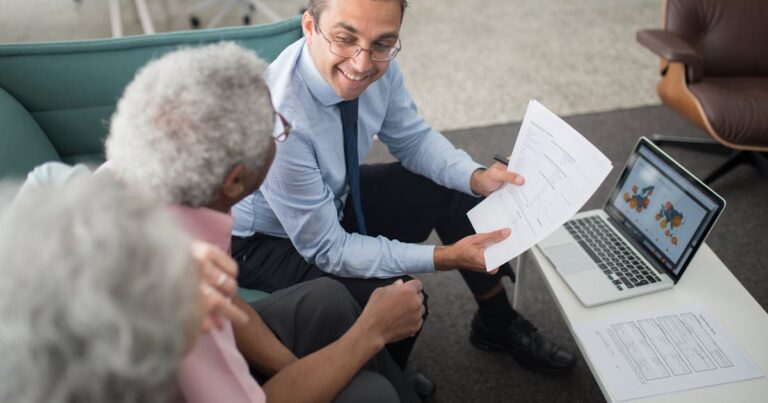 A financial adviser discussing income protection options with clients in a professional meeting.