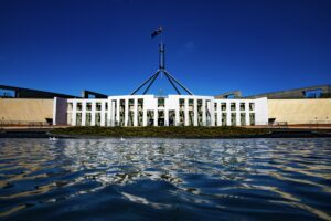 Australian Parliament House Canberra with national flag — Véurr Financial Planning specialist financial advice for federal public servants on CSS, PSS, and PSSap superannuation